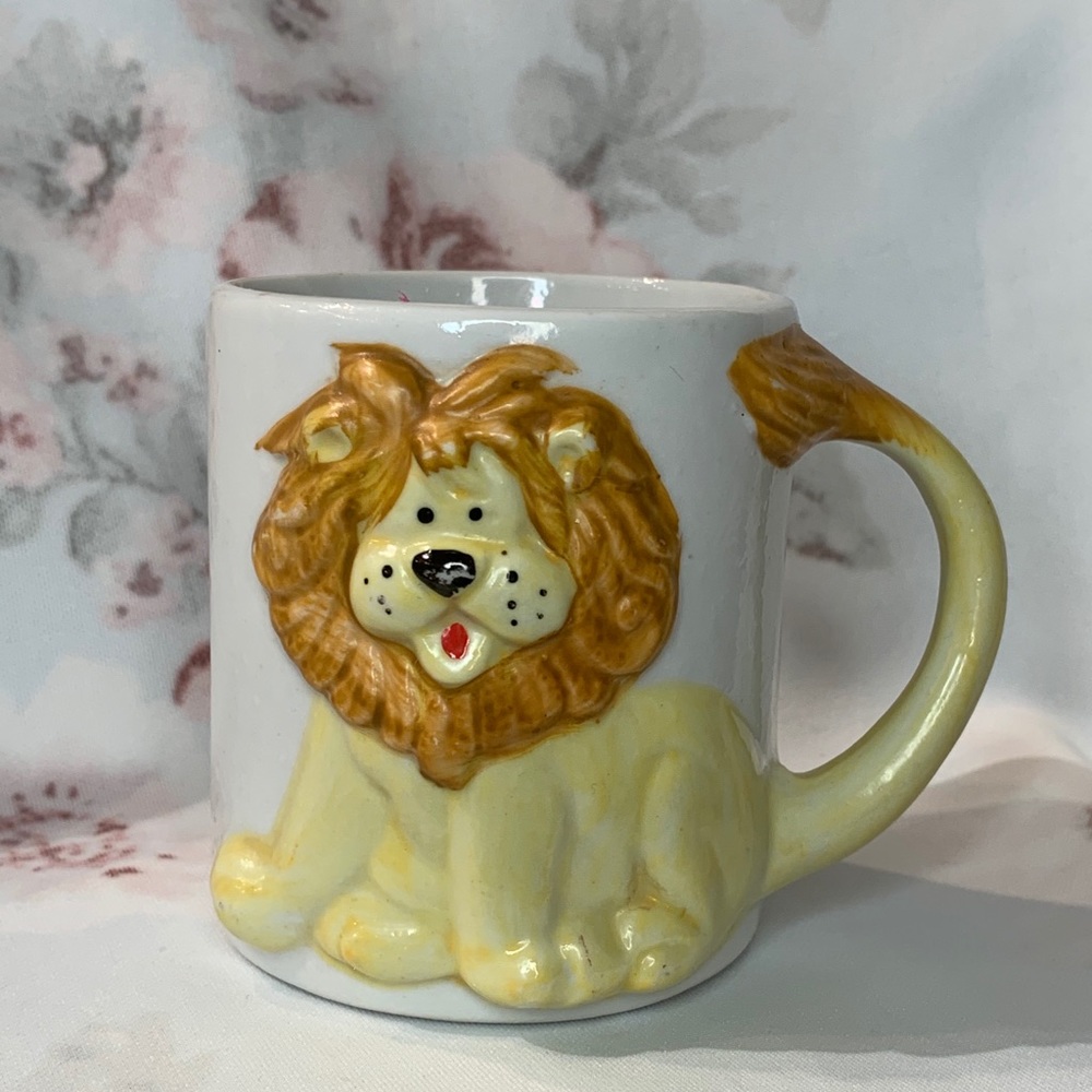 3D Embossed Lion Coffee Cup . J.S.N.Y.